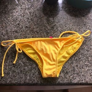OP bright yellow tie on sides bathing suite bottom